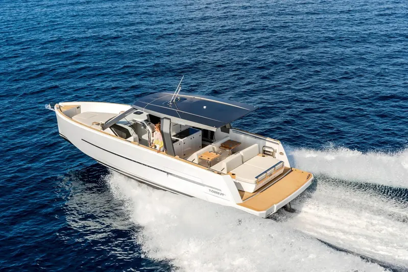  Yacht Photos Pics 2026 Fjord 39 XL yacht cruising on open blue sea, showcasing sleek design.