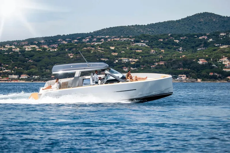  Yacht Photos Pics 2026 Fjord 39 XL yacht cruising on scenic coastal waters.