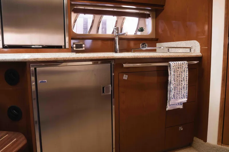  Yacht Photos Pics Luxurious 2008 Sea Ray 38 Sundancer yacht kitchen with stainless steel appliances and wood cabinetry.