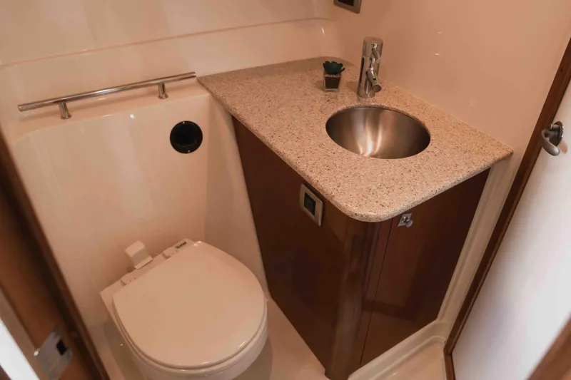  Yacht Photos Pics Luxurious bathroom in 2008 Sea Ray 38 Sundancer yacht with modern sink and toilet.