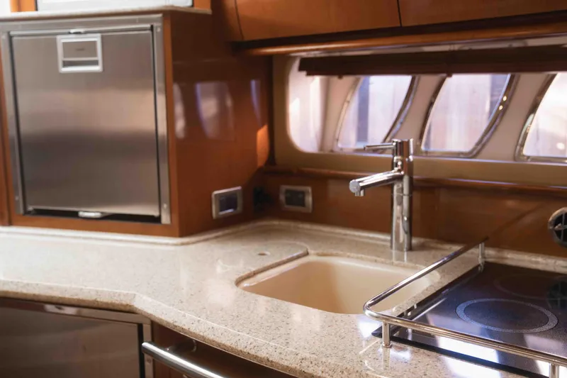  Yacht Photos Pics Luxurious 2008 Sea Ray 38 Sundancer yacht kitchen with modern sink and stovetop.