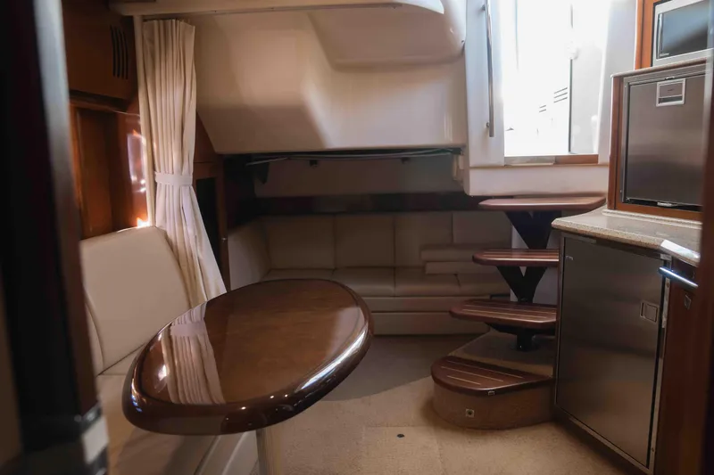  Yacht Photos Pics Interior of 2008 Sea Ray 38 Sundancer yacht with seating, table, and kitchenette.