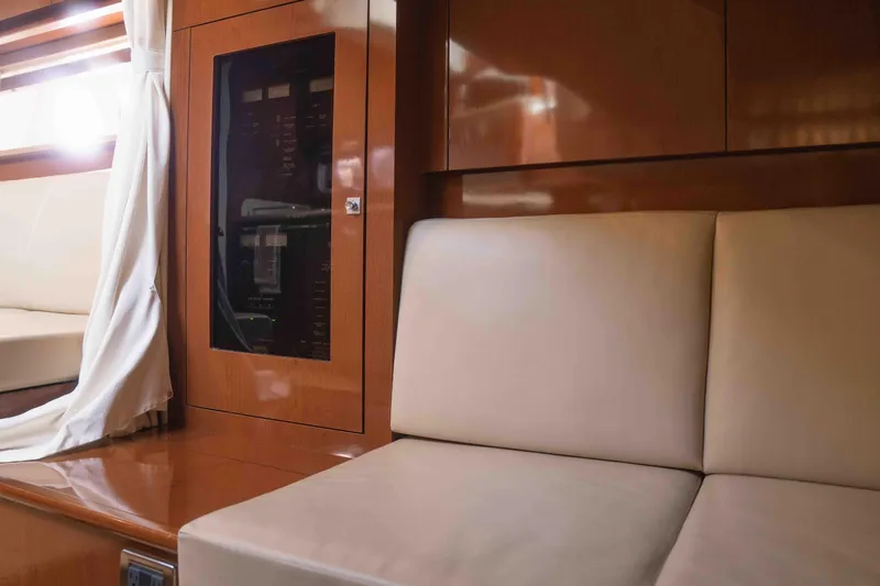  Yacht Photos Pics Interior of 2008 Sea Ray 38 Sundancer yacht with beige seating and wood paneling.