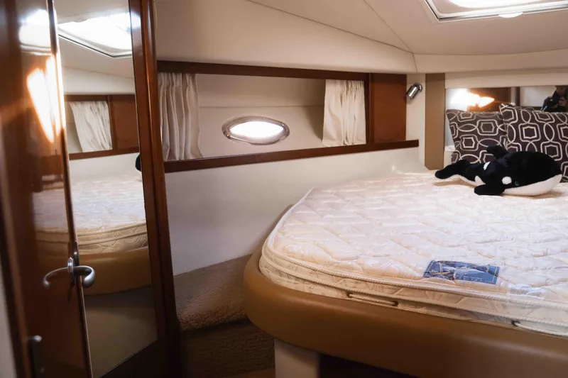  Yacht Photos Pics Luxurious cabin interior of 2008 Sea Ray 38 Sundancer yacht with plush bedding.