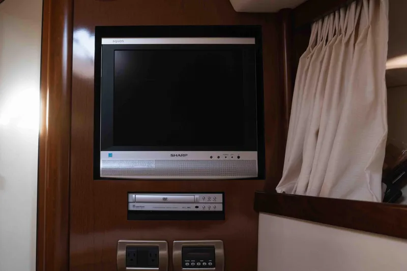  Yacht Photos Pics Sharp TV and DVD player in 2008 Sea Ray 38 Sundancer yacht interior.