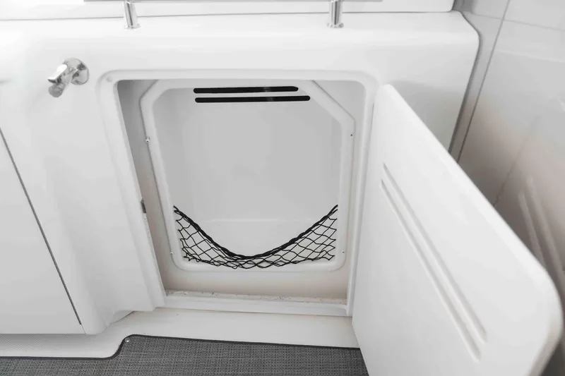  Yacht Photos Pics Open storage compartment on 2008 Sea Ray 38 Sundancer boat with netting inside.