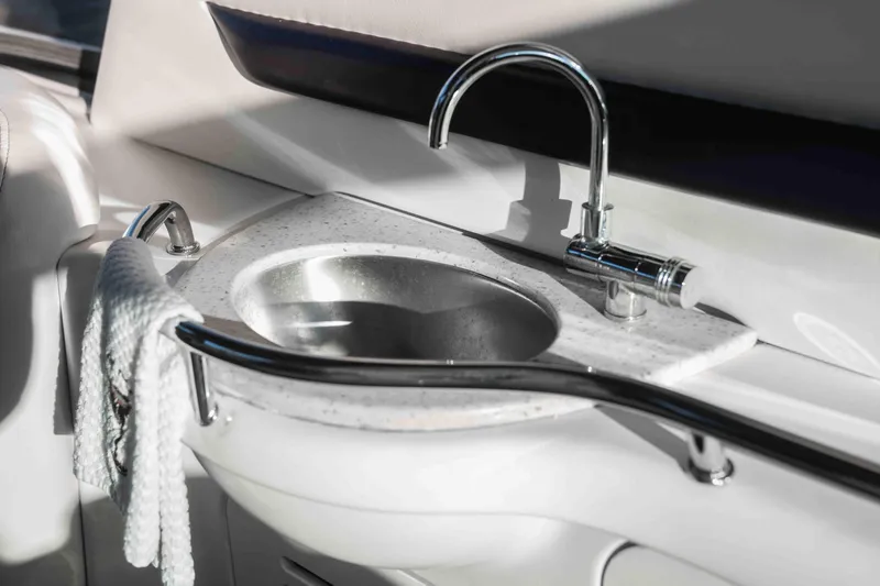  Yacht Photos Pics Luxury sink on 2008 Sea Ray 38 Sundancer yacht, featuring sleek chrome faucet and towel rail.