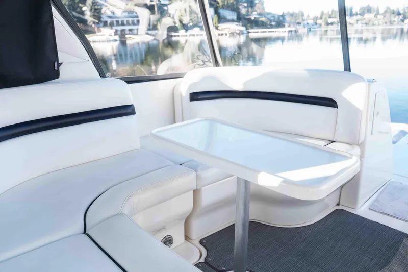  Yacht Photos Pics Luxurious interior of 2008 Sea Ray 38 Sundancer yacht with white seating and table.