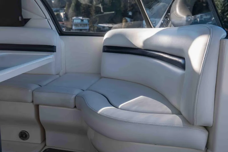  Yacht Photos Pics 2008 Sea Ray 38 Sundancer interior with white leather seating and table.