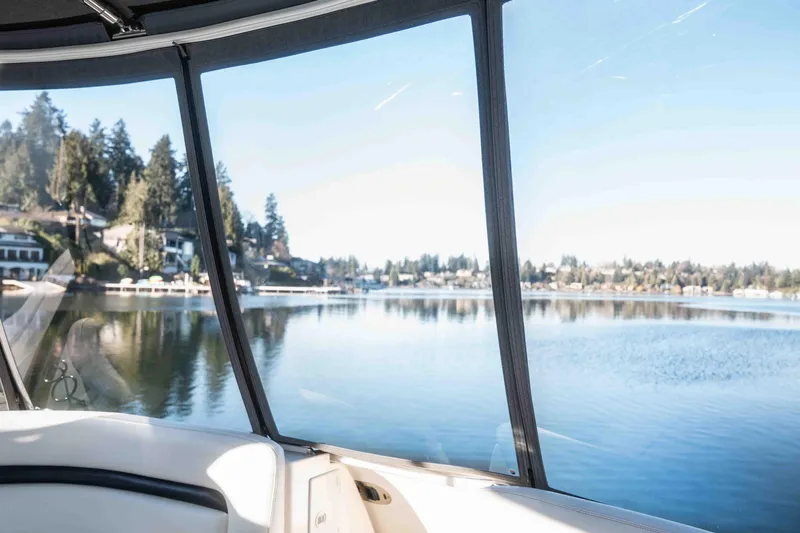  Yacht Photos Pics View from 2008 Sea Ray 38 Sundancer, overlooking serene lake and shoreline houses.