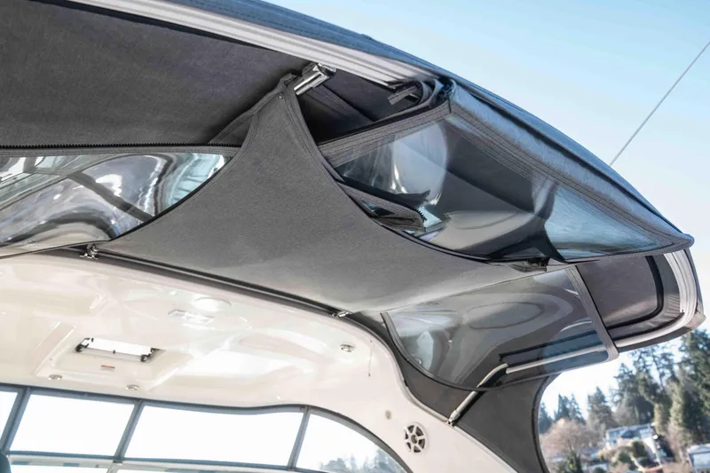  Yacht Photos Pics 2008 Sea Ray 38 Sundancer boat canopy with storage compartments and clear windows.