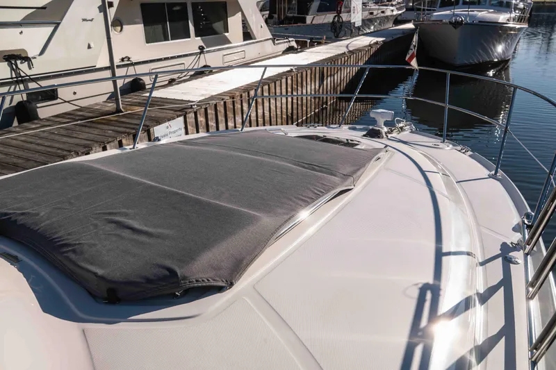  Yacht Photos Pics 2008 Sea Ray 38 Sundancer yacht docked at marina, featuring sleek design and sunpad.