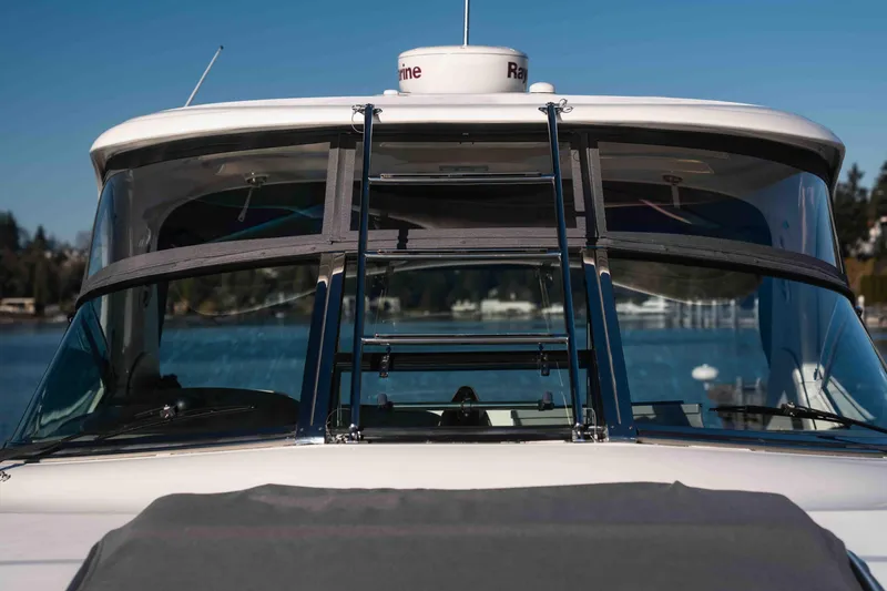  Yacht Photos Pics 2008 Sea Ray 38 Sundancer yacht, front view with clear blue sky background.