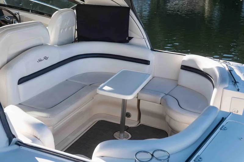  Yacht Photos Pics Luxurious seating area on a 2008 Sea Ray 38 Sundancer yacht, featuring white upholstery.