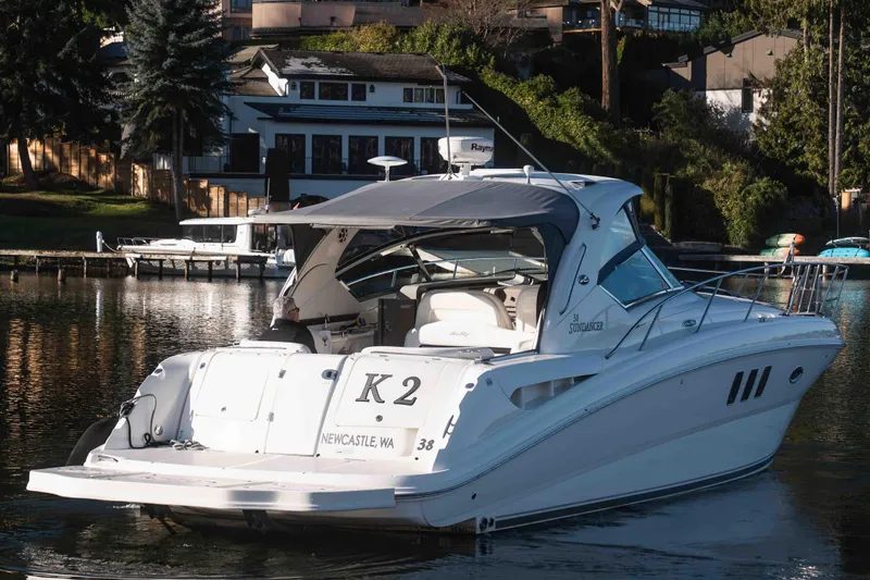  Yacht Photos Pics 2008 Sea Ray 38 Sundancer yacht docked in a scenic waterfront setting.