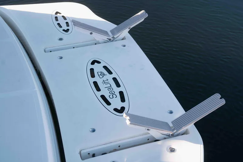  Yacht Photos Pics 2008 Sea Ray 38 Sundancer swim platform with SeaLift system, docked on calm water.