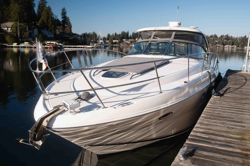  Yacht Photos Pics 2008 Sea Ray 38 Sundancer yacht docked on a serene lake.