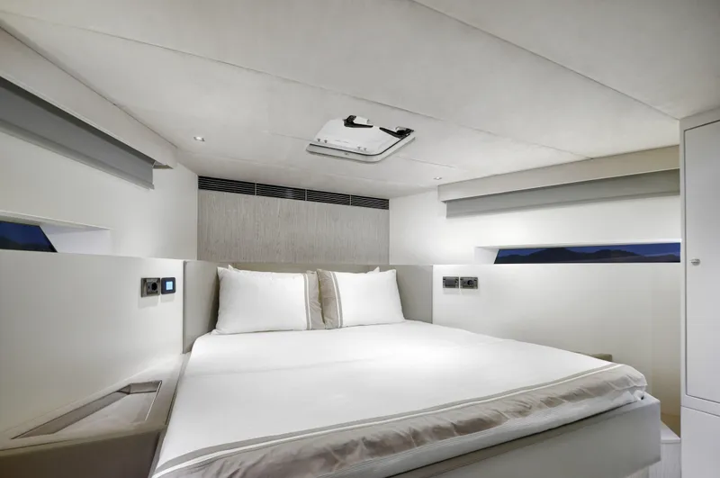 Mazu 62 Yacht Photos Pics Luxurious bedroom interior of 2025 Mazu Yachts 62, featuring modern design and comfortable bedding.
