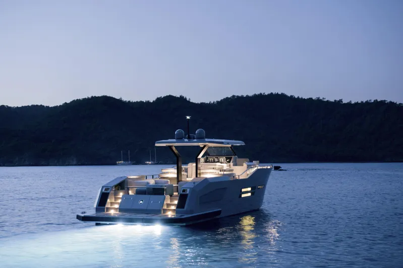 Mazu 62 Yacht Photos Pics Mazu Yachts 62, 2025 model, illuminated on serene waters at dusk.