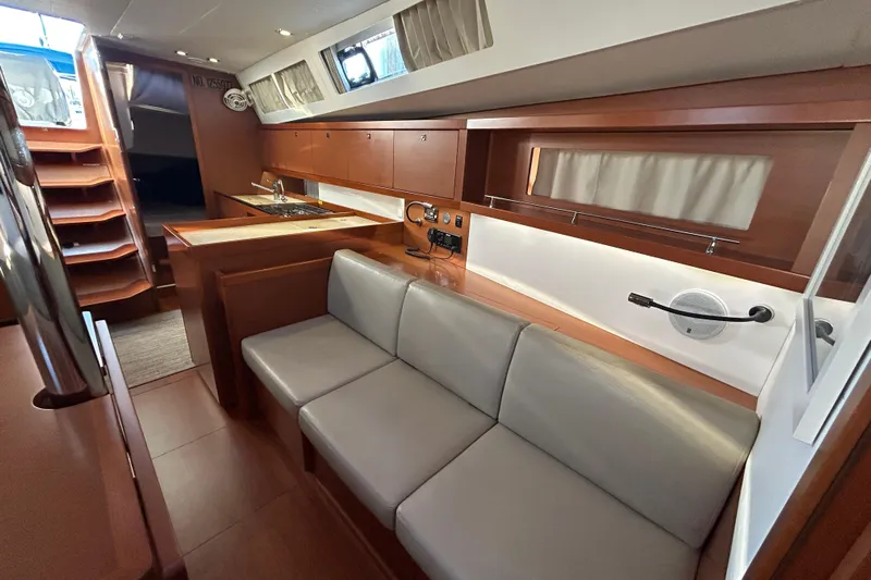  Yacht Photos Pics Interior of 2014 Beneteau Oceanis 41 yacht with modern kitchen and seating area.