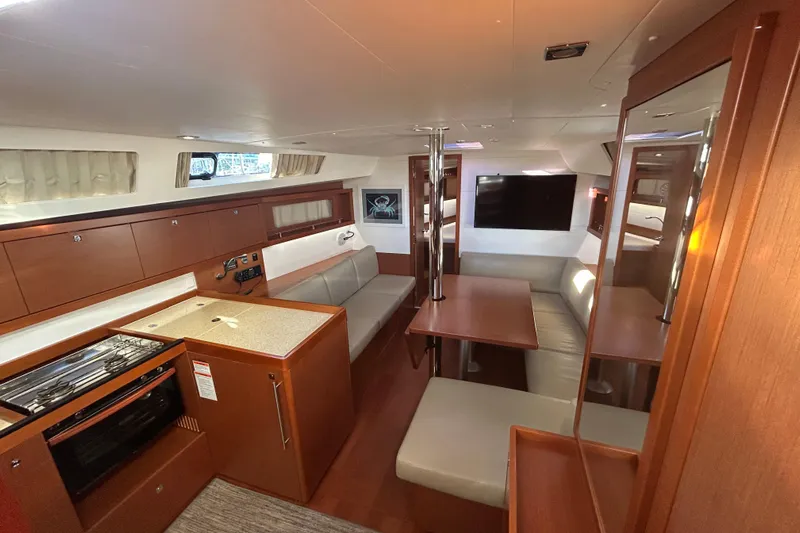  Yacht Photos Pics Interior of 2014 Beneteau Oceanis 41 yacht with modern kitchen and seating area.
