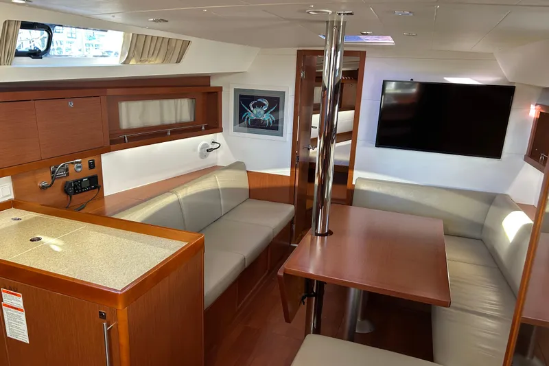  Yacht Photos Pics Luxurious interior of 2014 Beneteau Oceanis 41 yacht with modern seating and entertainment area.