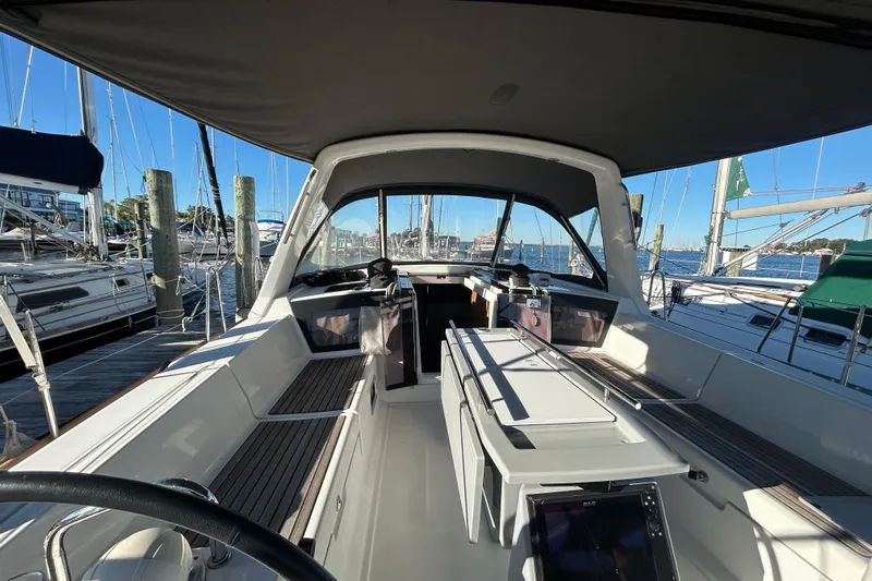  Yacht Photos Pics 2014 Beneteau Oceanis 41 sailboat cockpit with seating, docked at marina.