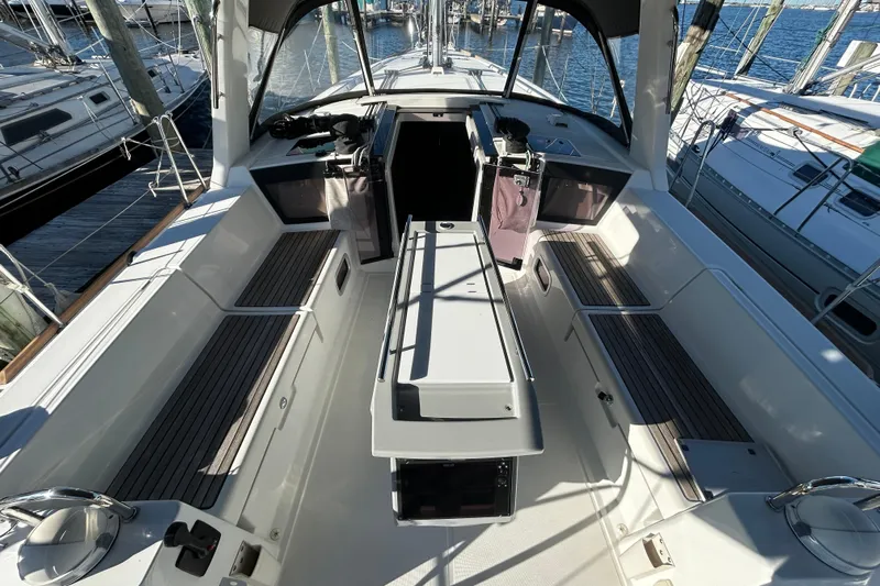  Yacht Photos Pics 2014 Beneteau Oceanis 41 sailboat cockpit with seating and helm, docked at marina.