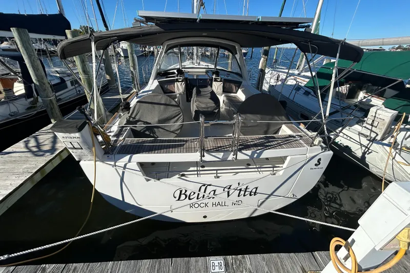  Yacht Photos Pics 2014 Beneteau Oceanis 41 sailboat docked, rear view with "Bella Vita" name visible.