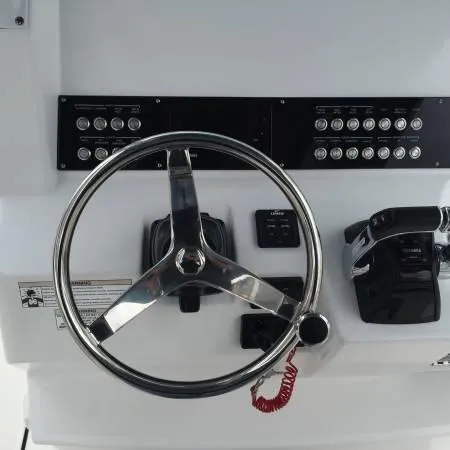  Yacht Photos Pics Steering console of 2015 Edgewater 280CC boat with control panel and throttle.