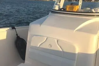  Yacht Photos Pics 2015 Edgewater 280CC boat on water, featuring sleek white design and spacious deck.