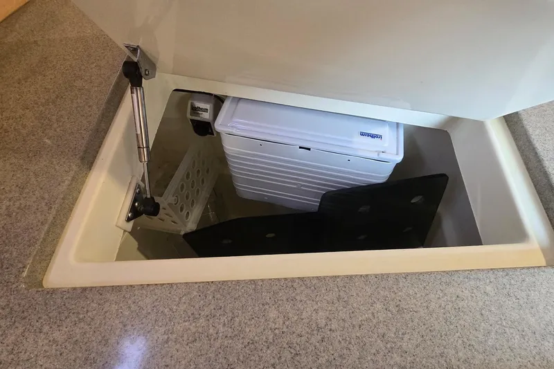 Irie Yacht Photos Pics Storage compartment in a 2018 Tartan 345 yacht, featuring organized interior space.