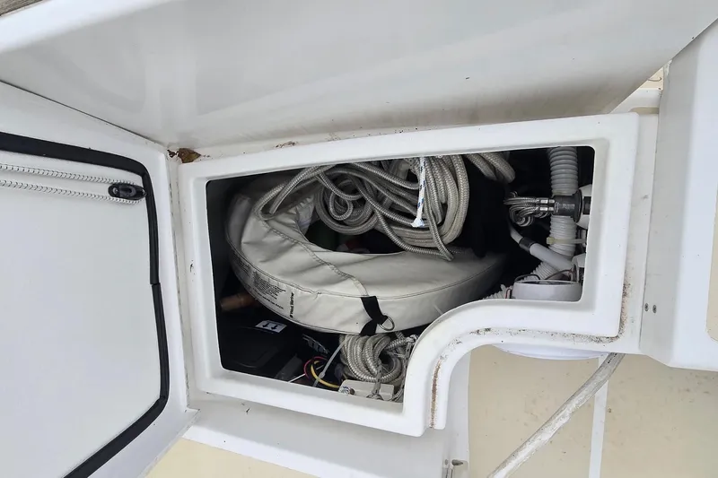 Irie Yacht Photos Pics Storage compartment on a 2018 Tartan 345 sailboat, containing ropes and equipment.
