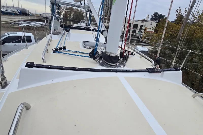 Irie Yacht Photos Pics 2018 Tartan 345 sailboat deck with rigging and mast in marina setting.