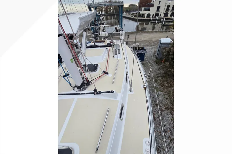 Irie Yacht Photos Pics Tartan 345 sailboat deck view, 2018 model, docked near waterfront buildings.