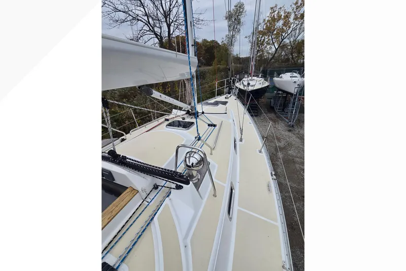 Irie Yacht Photos Pics 2018 Tartan 345 sailboat on land, showcasing deck and rigging details.