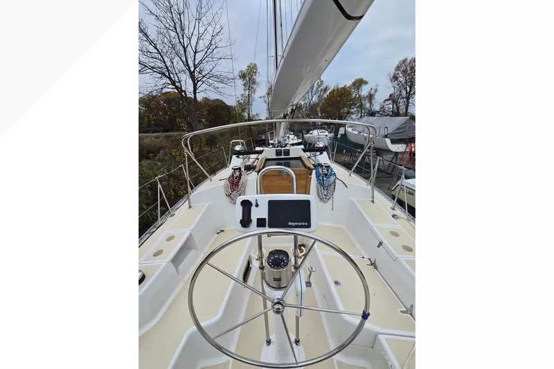 Irie Yacht Photos Pics 2018 Tartan 345 sailboat cockpit with steering wheel and navigation equipment.