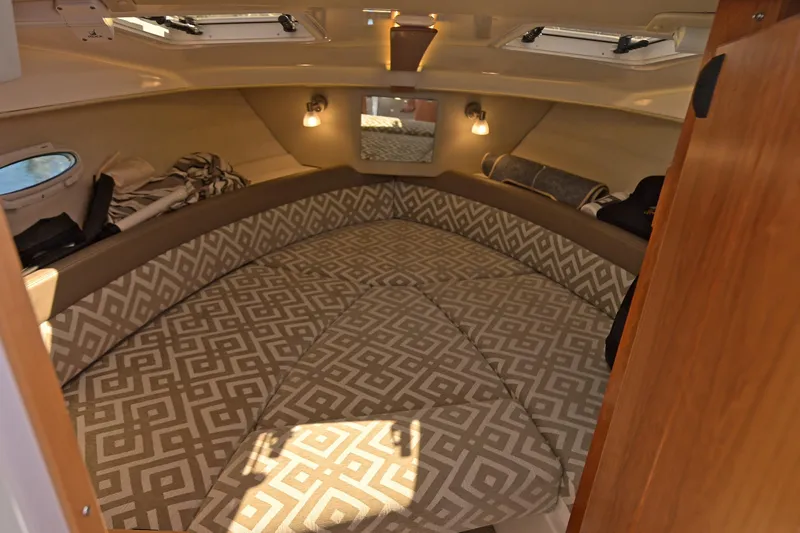 Cancelled Yacht Photos Pics 2024 Cutwater C-248 Coupe interior cabin with patterned cushions and ambient lighting.