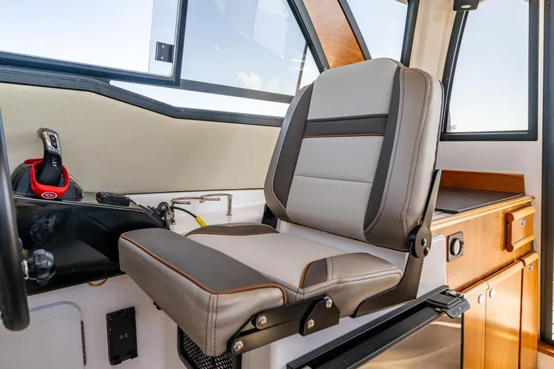 Cancelled Yacht Photos Pics 2024 Cutwater C-248 Coupe interior with modern helm seat and control panel.