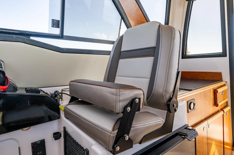 Cancelled Yacht Photos Pics 2024 Cutwater C-248 Coupe interior with modern helm seat and dashboard.