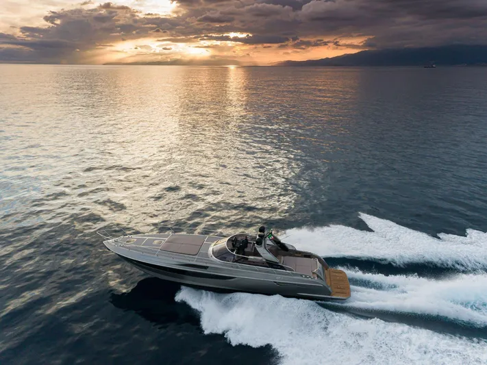  Yacht Photos Pics 2024 Rizzardi GR SESSANTATRE yacht cruising at sunset on open water.