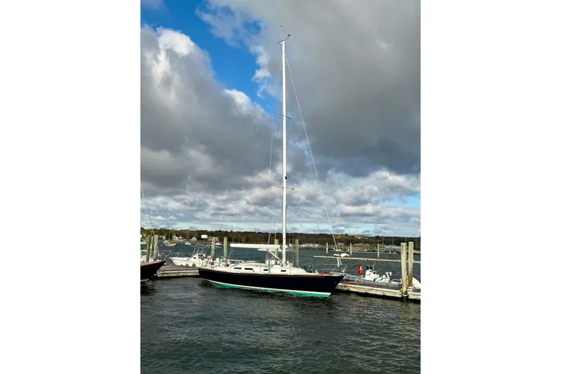 Kittywake Yacht Photos Pics 1996 J Boats J/42 sailboat docked under cloudy sky.