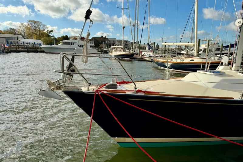 Kittywake Yacht Photos Pics Sailboat docked in marina, J Boats J/42 model, 1996, with clear sky and water.