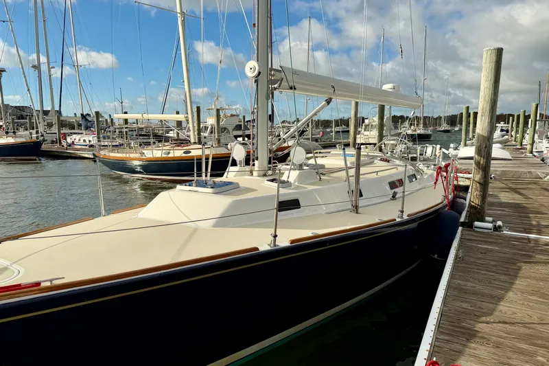 Kittywake Yacht Photos Pics 1996 J Boats J/42 sailboat docked at a marina under a blue sky.