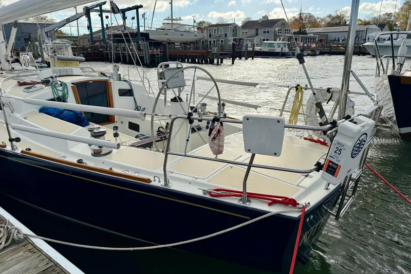 Kittywake Yacht Photos Pics Sailboat docked at marina, J Boats J/42 model, 1996, with clear sky and water view.
