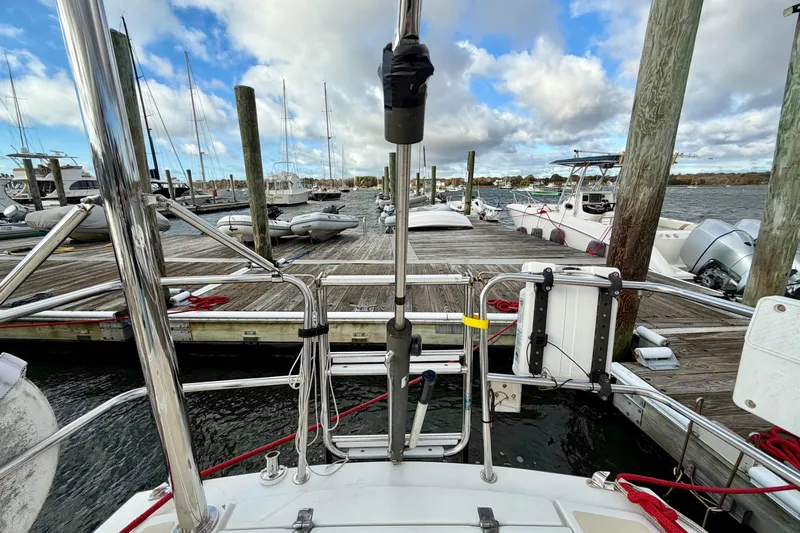 Kittywake Yacht Photos Pics Sailboat docked at marina, J Boats J/42, 1996 model, with clear sky and water view.