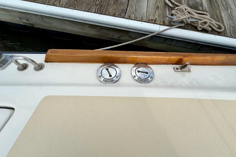 Kittywake Yacht Photos Pics Deck fittings on a 1996 J Boats J/42 sailboat near a wooden dock.