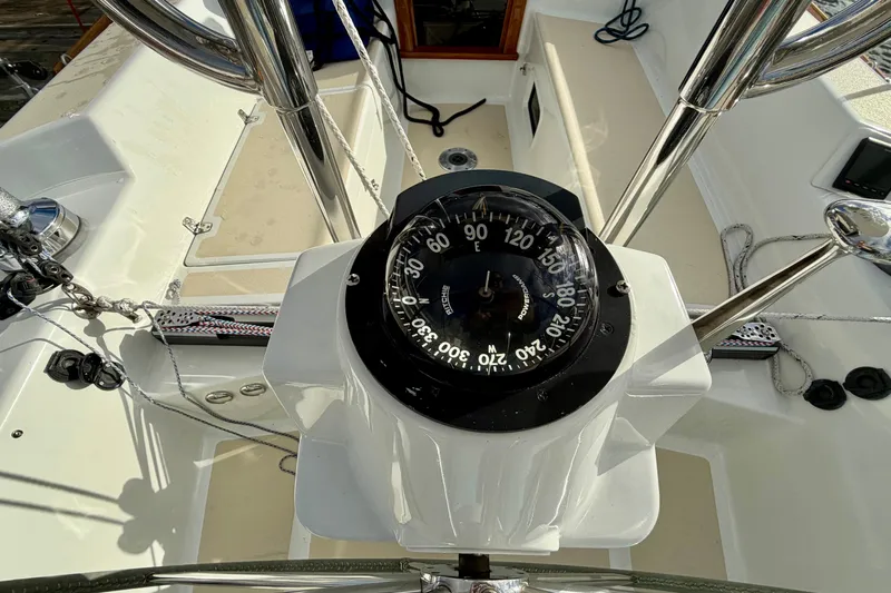 Kittywake Yacht Photos Pics Compass on 1996 J Boats J/42 sailboat, showcasing cockpit and steering wheel.