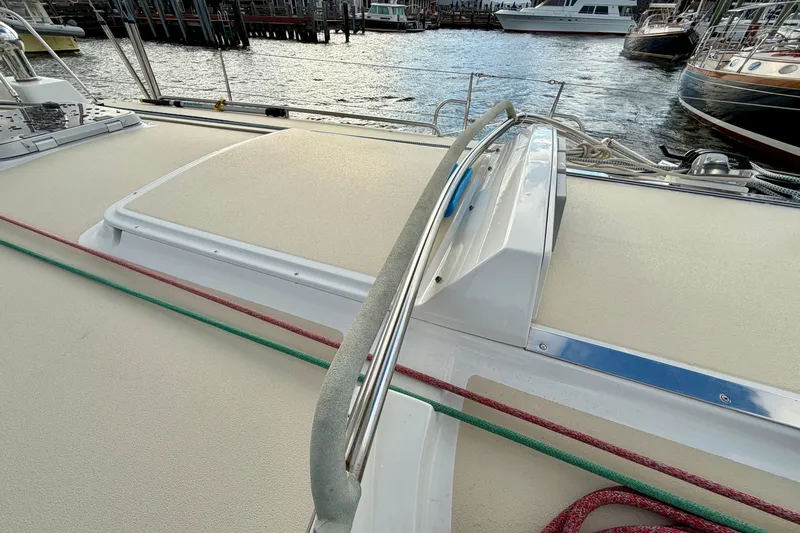 Kittywake Yacht Photos Pics Deck view of a 1996 J Boats J/42 sailboat, featuring ropes and a marina backdrop.