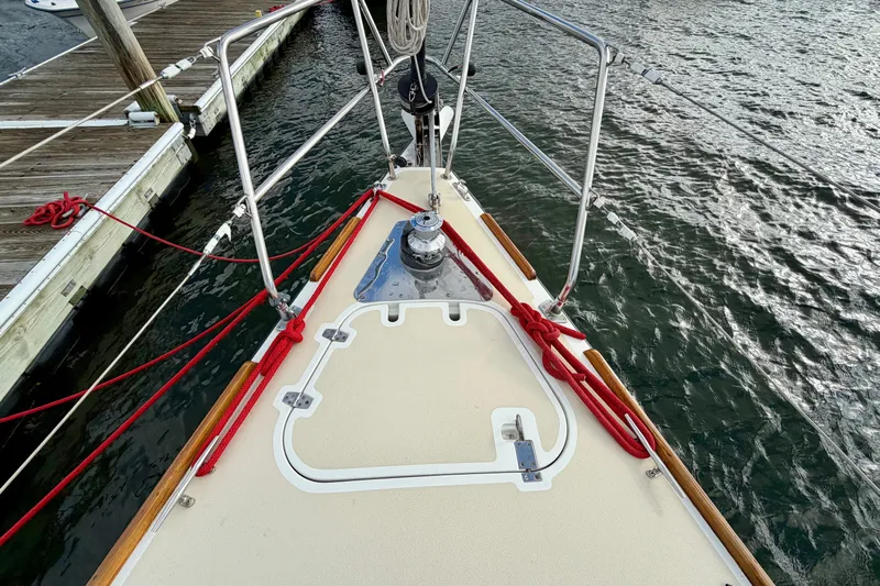 Kittywake Yacht Photos Pics Bow of 1996 J Boats J/42 sailboat with red ropes and dock view.